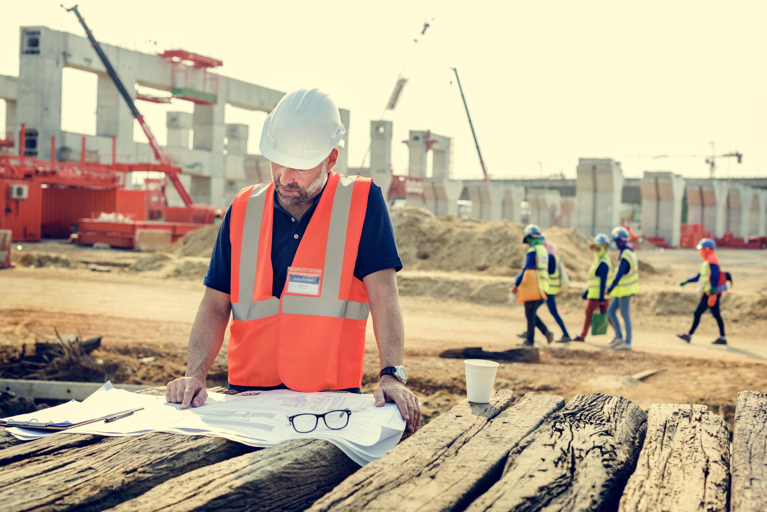 Architect and client reviewing building blueprints