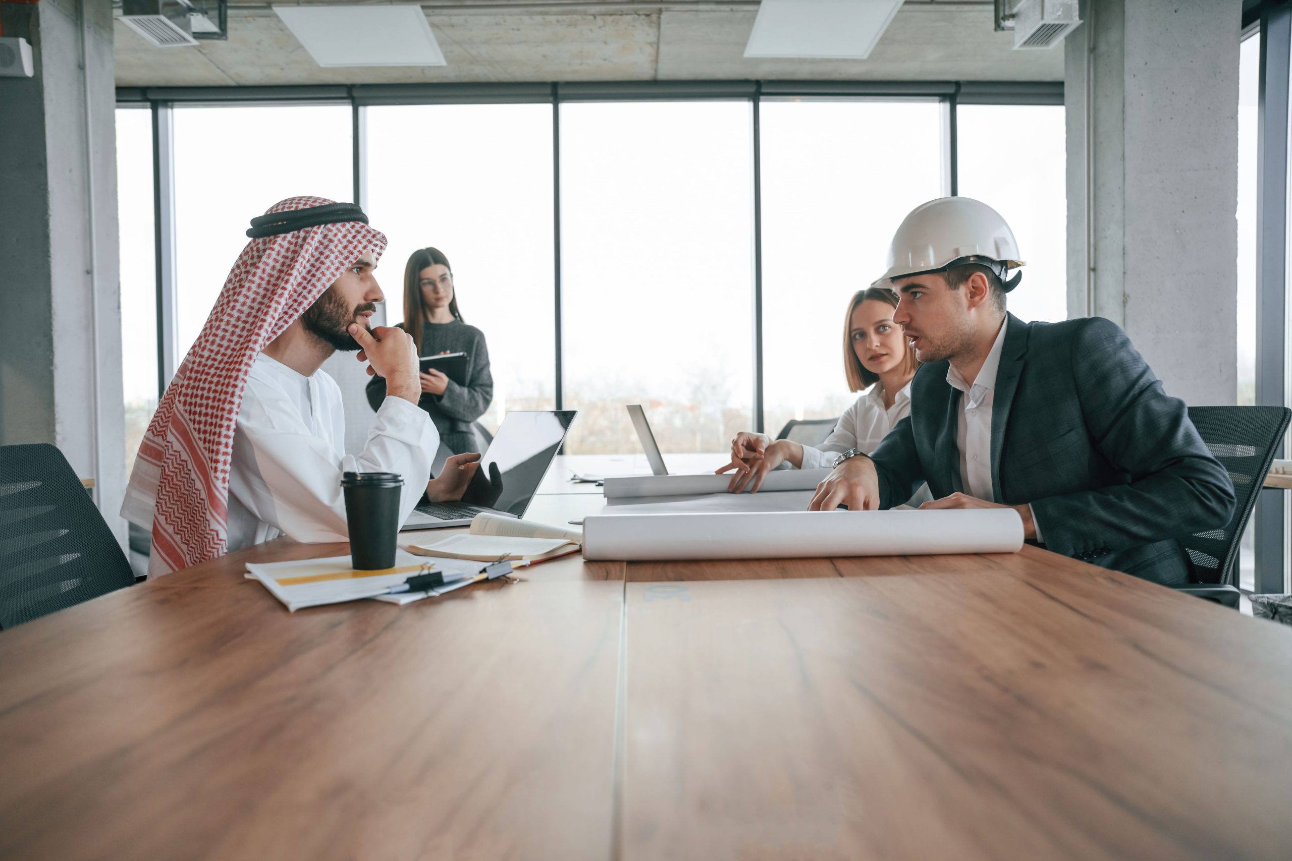 UAE project management consultants discussing strategy in a boardroom